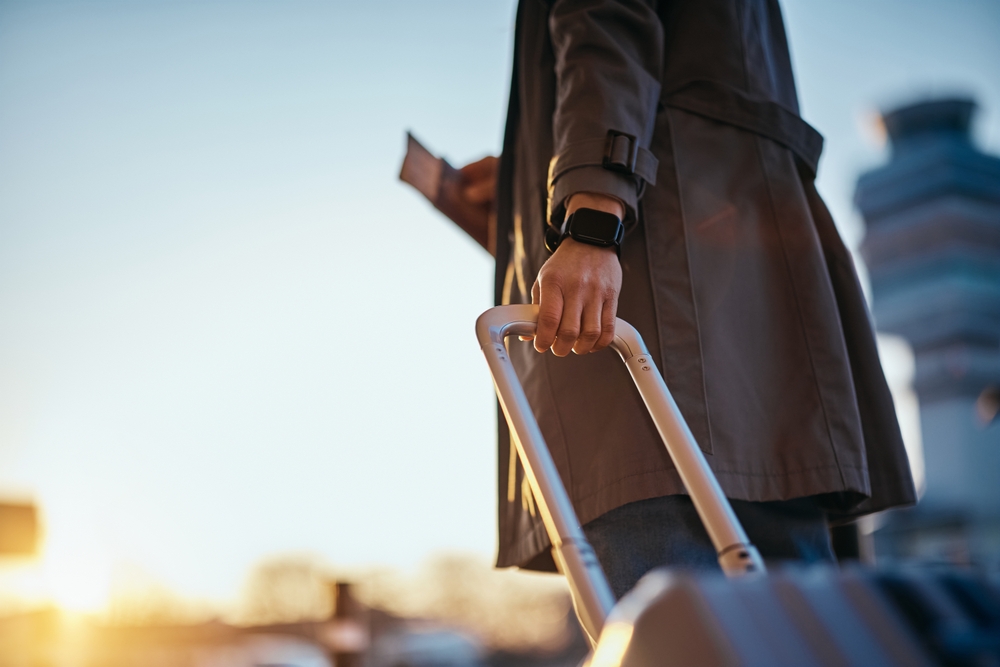 close,up,of,woman,with,travel,bag,at,the,airport